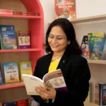 Dr. Vaidehi Deodhar beside the clinic bookshelf
