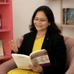 Dr. Vaidehi Deodhar reading from a Garbhasanskar book