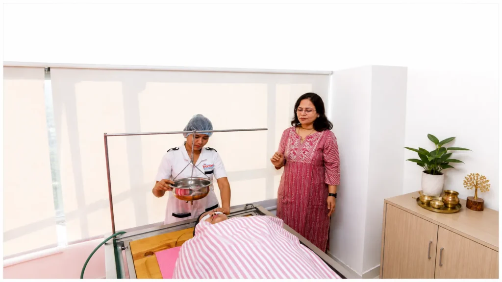A Panchakarma therapy session in progress at the clinic