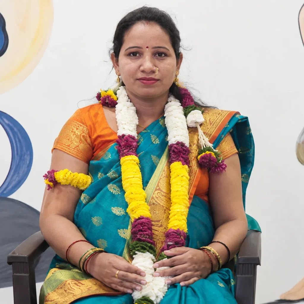 Smiling expectant mother wearing a flower garland
